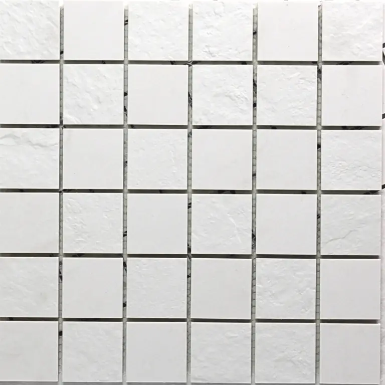 White square tiles arranged in an even grid with light gray grout lines, forming a clean tiled wall.