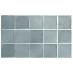 Blue-gray ceramic tile mosaic in a 5×4 grid with visible grout lines and subtle texture.