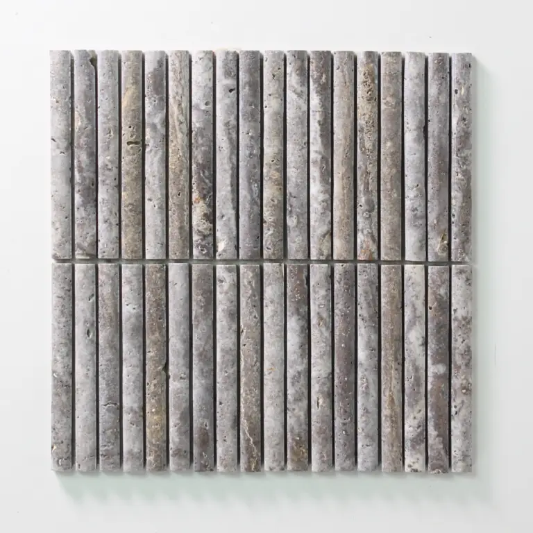 Grid of slim, gray stone tiles set on a white background, forming a rectangular panel with a rough, speckled texture.