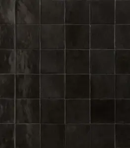 Dark glossy square tiles arranged in a grid, forming a tiled wall or floor surface.