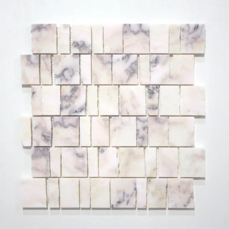 Square marble mosaic wall art made of pale pink‑cream tiles arranged in a grid pattern on a white wall.