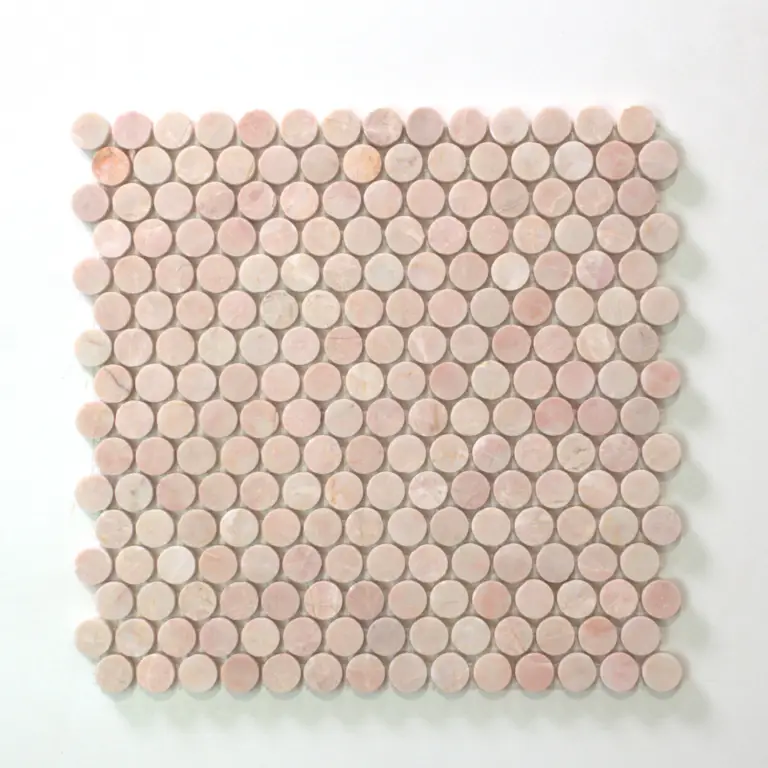 Grid of pink circular tablets arranged on a white background, like a mosaic of pills.