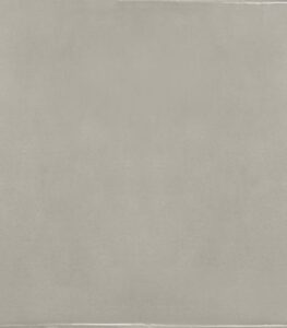 Close-up of a smooth light-gray concrete surface with subtle texture and faint edge lines.