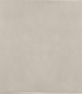 Plain beige tiled surface with faint edges and subtle texture.