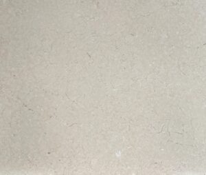 Beige textured stone surface with subtle veins and cracks.