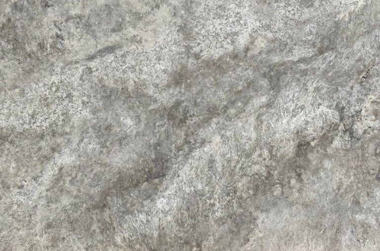 Close-up of a rough gray concrete texture with mottled, weathered patterns.