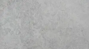Close-up of a gray concrete texture with a rough, speckled surface.