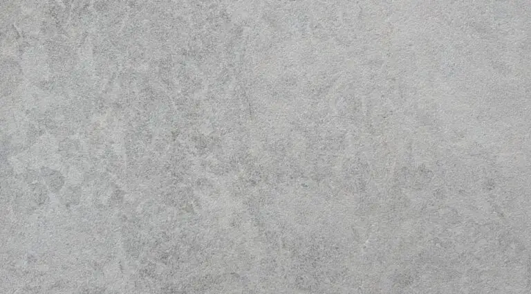 Close-up of a gray concrete texture with a rough, speckled surface.