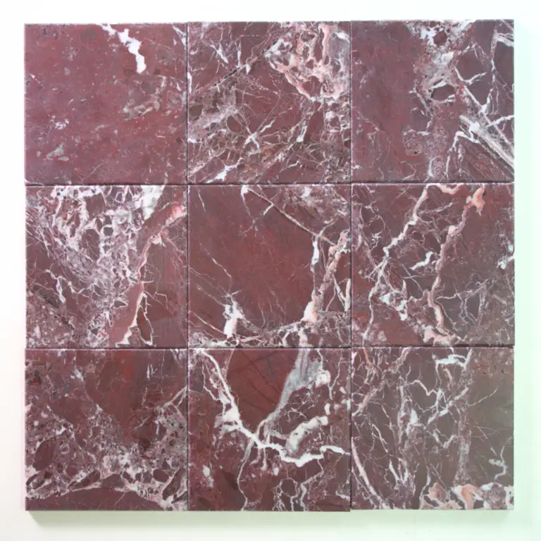Nine red marble tiles arranged in a 3x3 grid with white veining across each square.