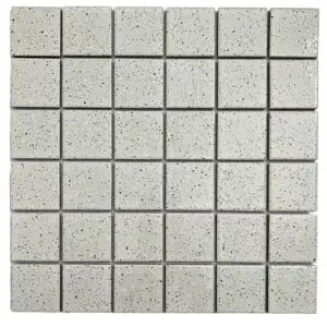 Grid of light gray speckled terrazzo tiles arranged in neat rows and columns, showing a uniform mosaic pattern.