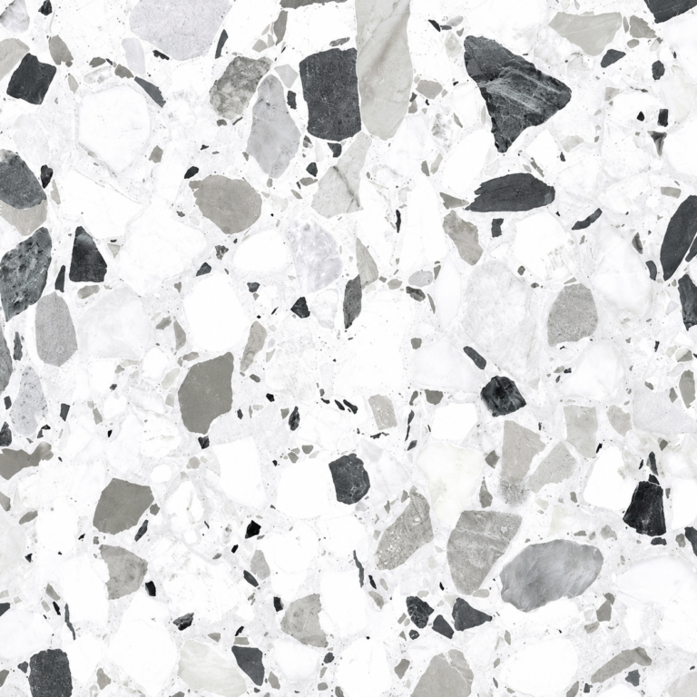Close-up of terrazzo surface with scattered white, gray, and black stone chips in cement mix.