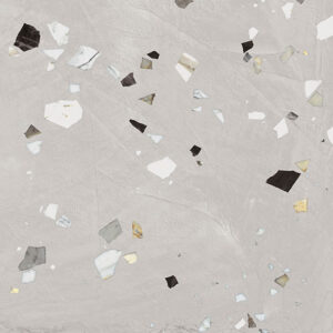 Light gray terrazzo floor with irregular white, black, and gold chips scattered across the surface.